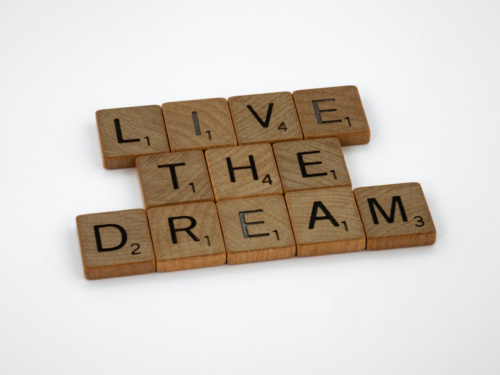 scrabble letter tiles forming a message