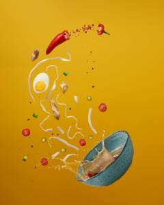an animation of spilled soup on a yellow background