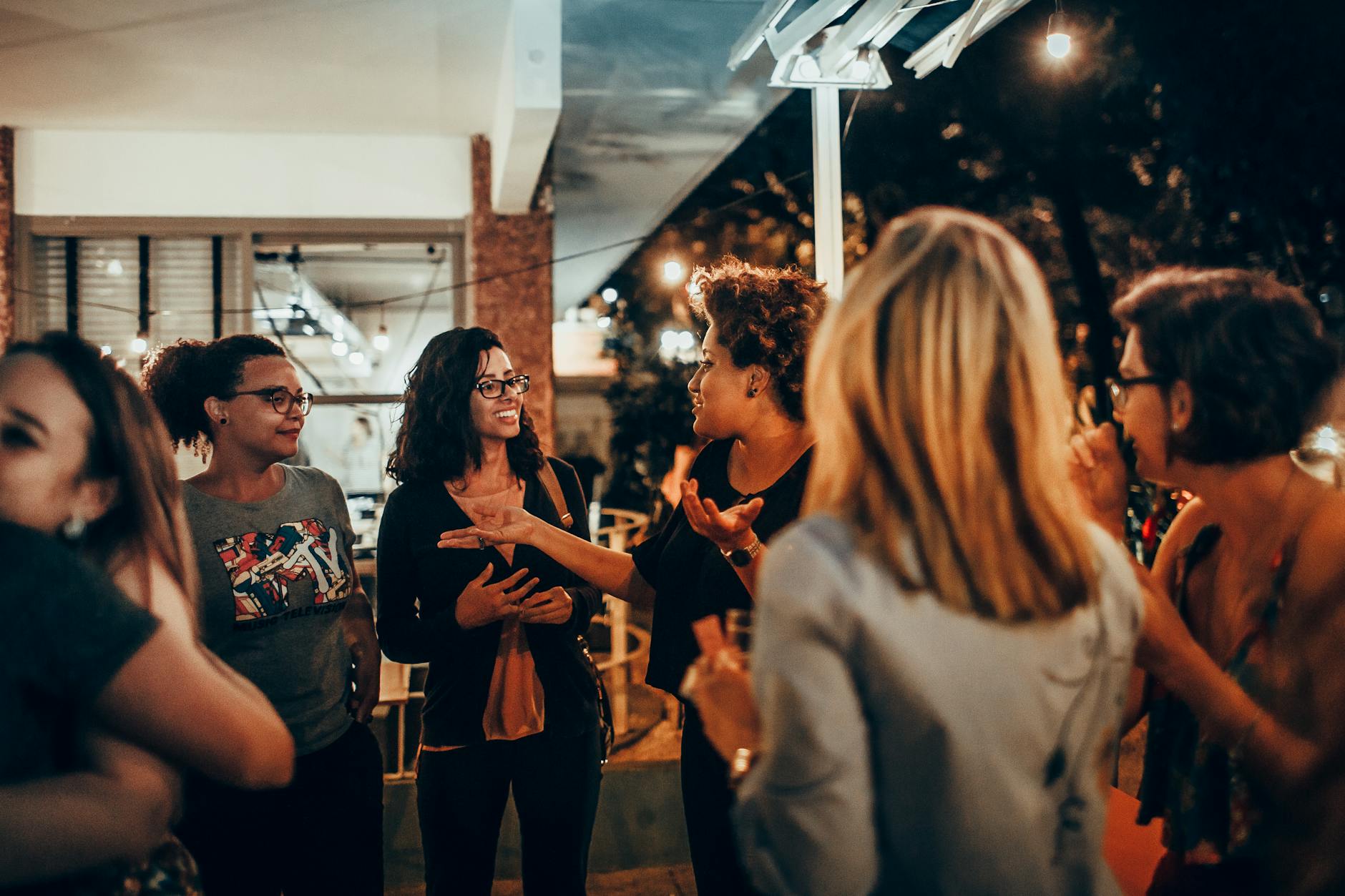 lively group of women chatting at night